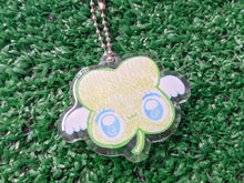 Load image into Gallery viewer, a cute, cartoonish four-leaf clover charm keychain with white wings and blue eyes, attached to a silver ball chain
