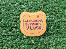 Load image into Gallery viewer, a yellow bear-shaped acrylic pin with the words 'EMOTIONAL SUPPORT PLUSH' in navy blue and red
