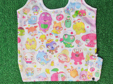 Load image into Gallery viewer, a white shopping bag style tote bag featuring nostalgic character doodles on the print. in the right corner, there is a small carrying case for the bag featuring a clip.

